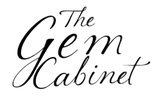 Logo of 'The Gem Cabinet' with elegant script font on a white background